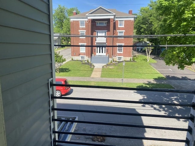 view of gate featuring a yard