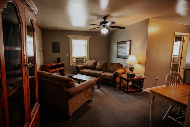 living area with visible vents, dark carpet, baseboard heating, cooling unit, and a ceiling fan