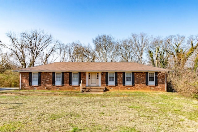 single story home with a front yard and brick siding