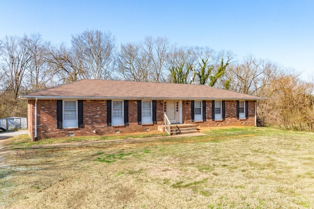 ranch-style house with crawl space, a front yard, brick siding, and roof with shingles