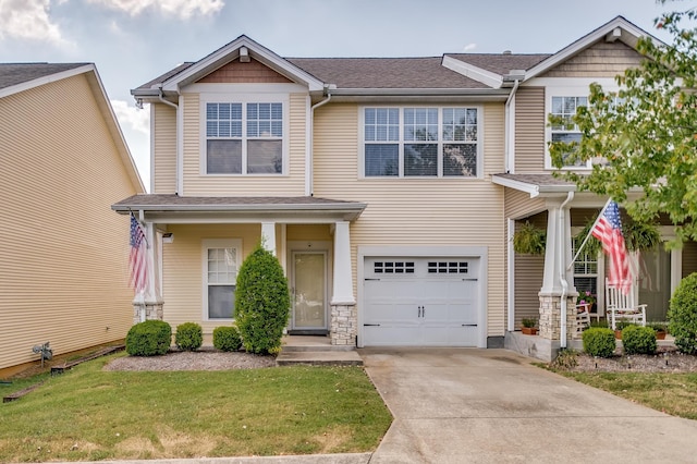 view of front of house featuring an attached garage, concrete driveway, and a front yard