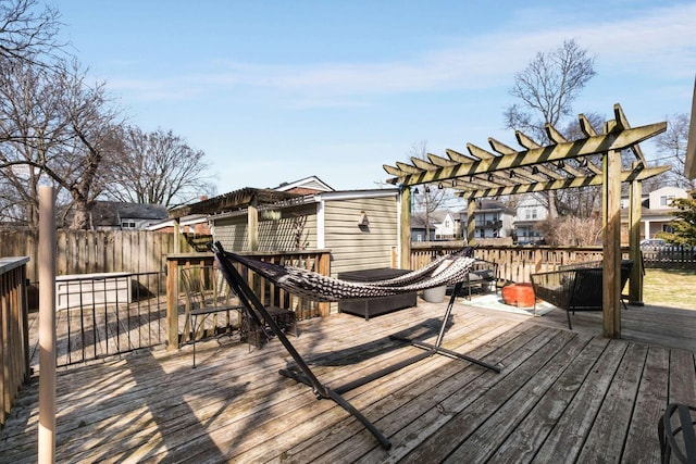 deck featuring a pergola and fence