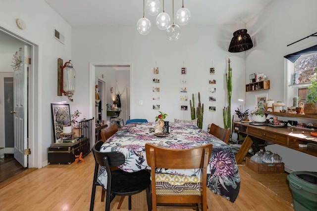 dining room with visible vents and light wood-type flooring