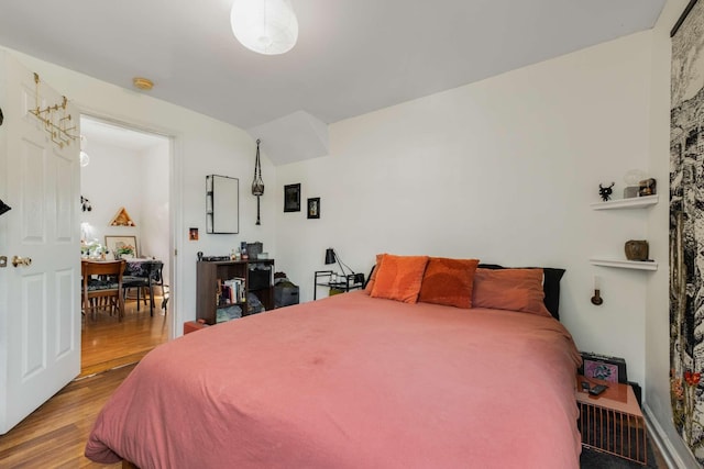 bedroom featuring wood finished floors