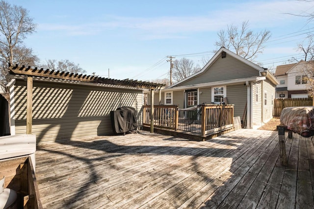 wooden terrace with a pergola and fence