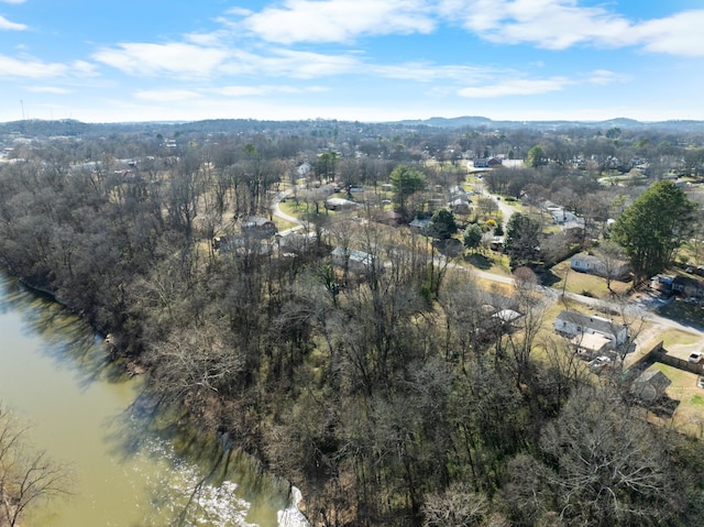 drone / aerial view featuring a mountain view and a wooded view