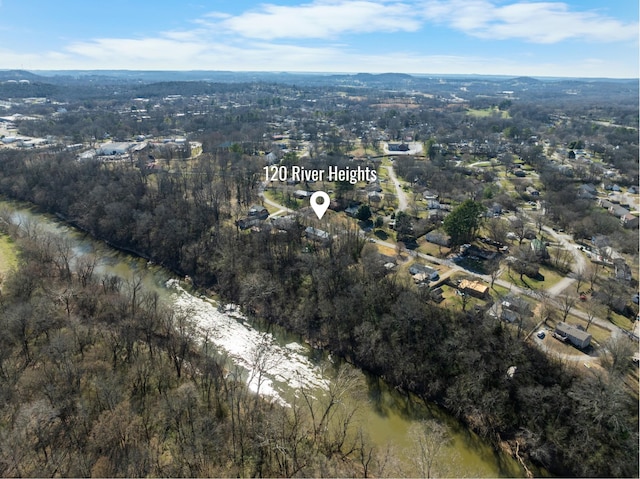 bird's eye view featuring a water view and a wooded view