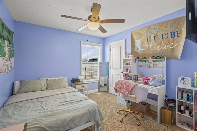 carpeted bedroom featuring baseboards and ceiling fan