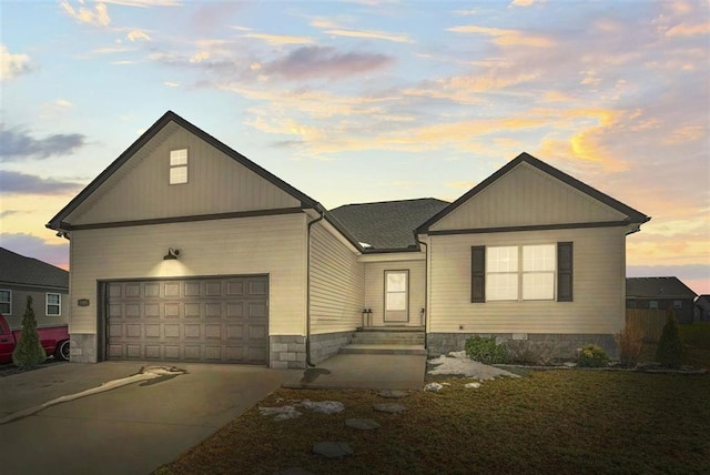 view of front facade with concrete driveway and a garage