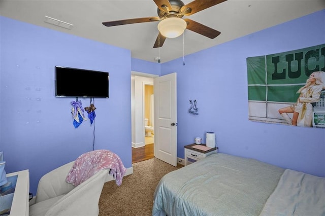 bedroom featuring visible vents, baseboards, a ceiling fan, and carpet floors