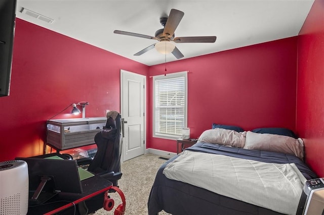 bedroom with baseboards, visible vents, carpet floors, and ceiling fan