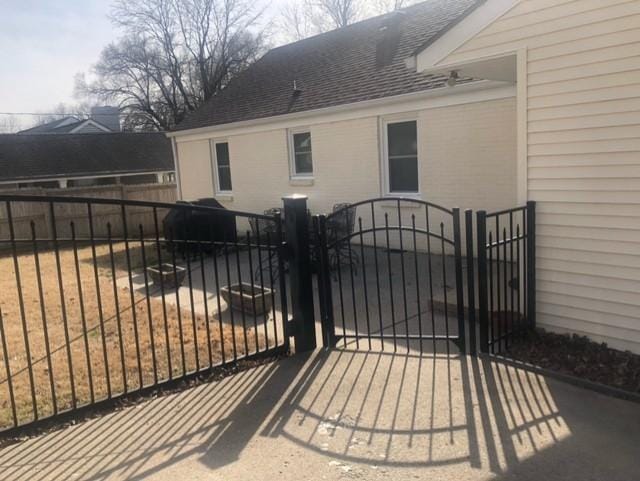 view of gate with fence