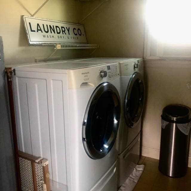 laundry area with laundry area and separate washer and dryer