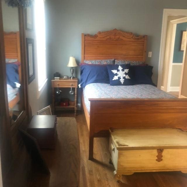 bedroom with wood finished floors