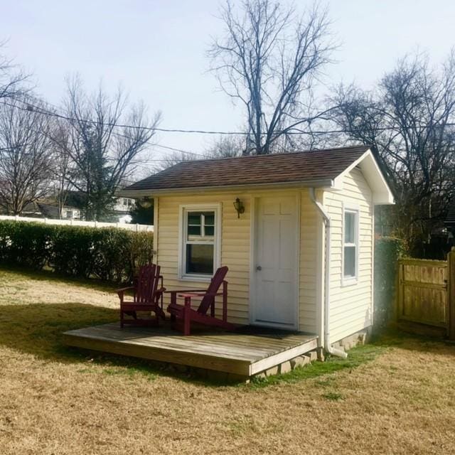 view of shed with fence