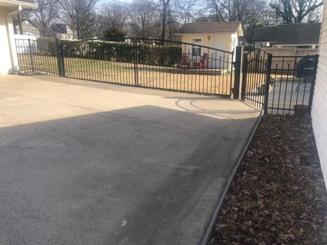 view of gate featuring fence