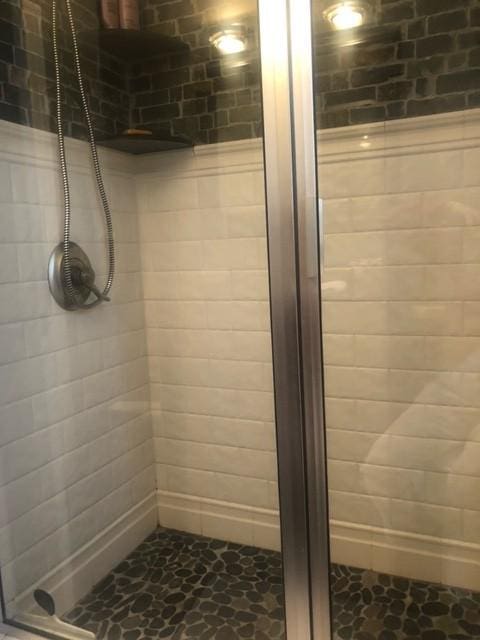 bathroom featuring a shower stall