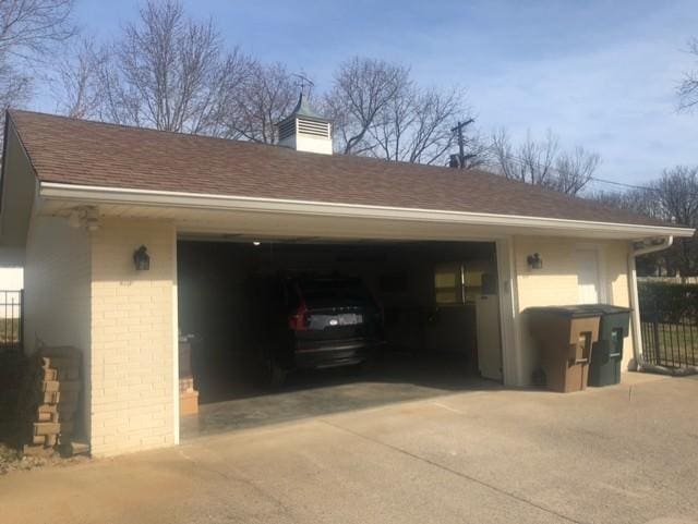 garage with fence