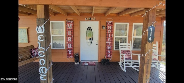 doorway to property featuring a porch