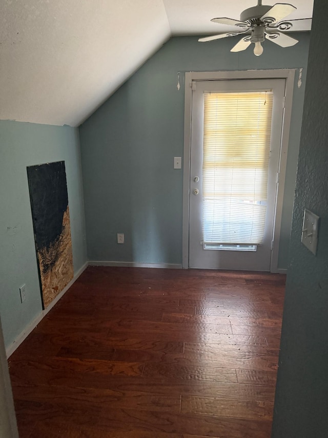 additional living space featuring baseboards, wood-type flooring, lofted ceiling, and ceiling fan