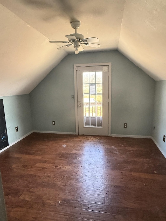 additional living space with vaulted ceiling, ceiling fan, baseboards, and wood finished floors