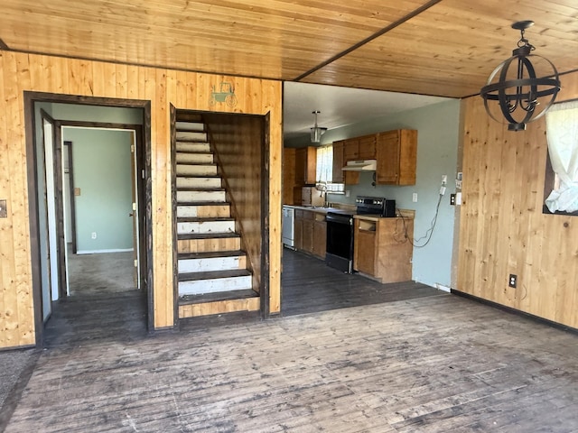 interior space with wood finished floors, wooden walls, and wooden ceiling