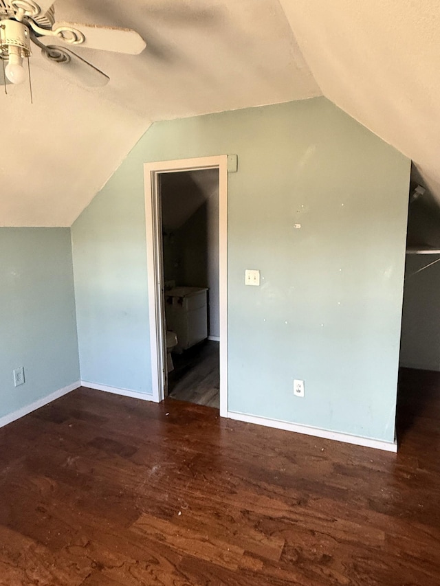 additional living space featuring a ceiling fan, vaulted ceiling, wood finished floors, and baseboards