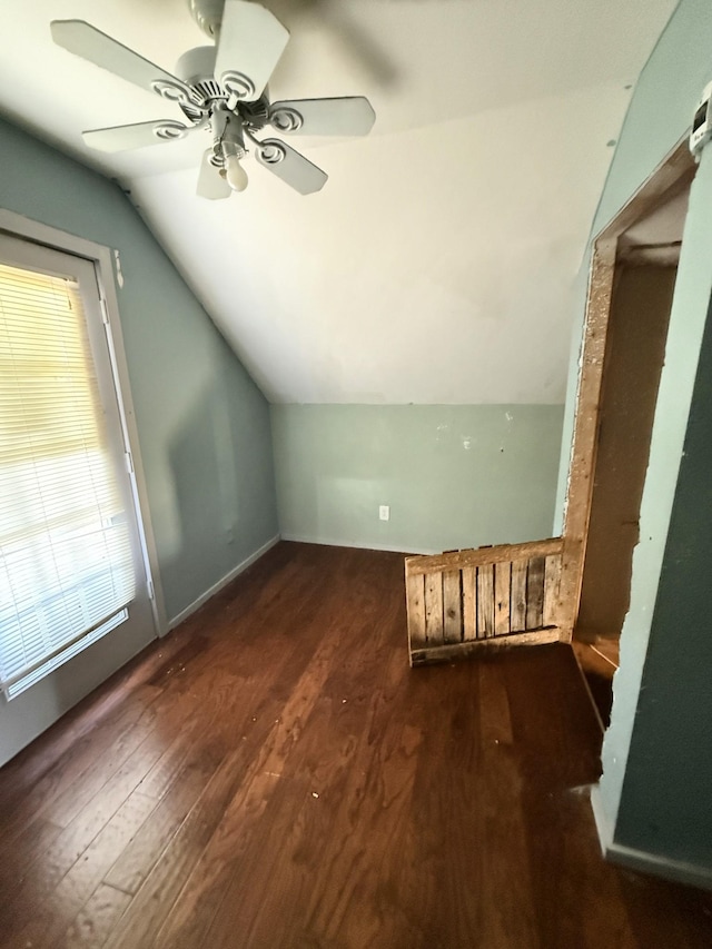 bonus room featuring dark wood finished floors, lofted ceiling, and ceiling fan