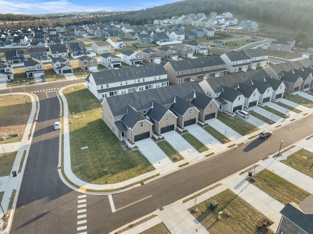 birds eye view of property with a residential view