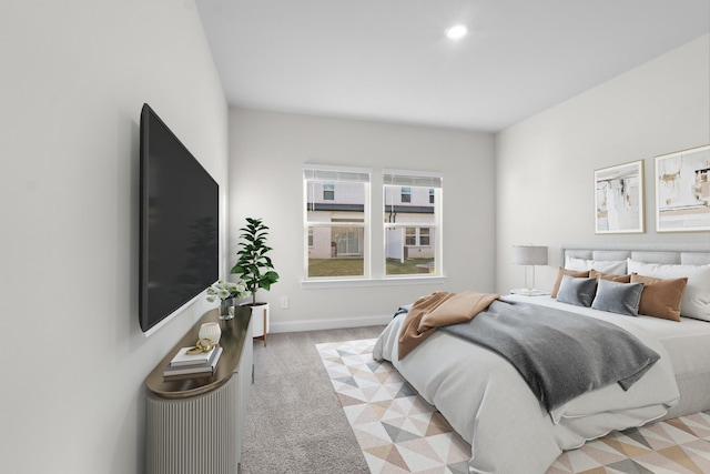 bedroom featuring recessed lighting, light colored carpet, and baseboards