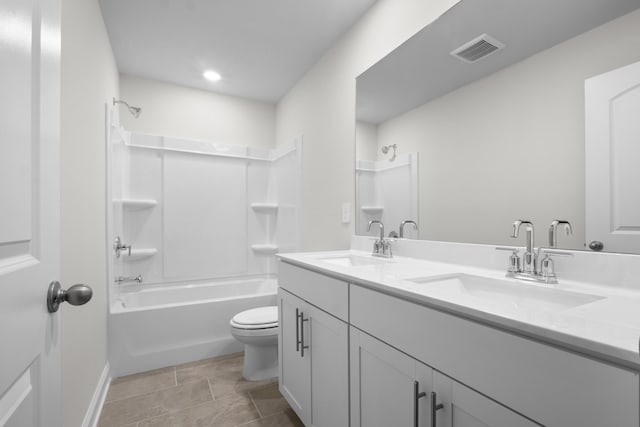 full bath with double vanity, toilet, visible vents, and a sink