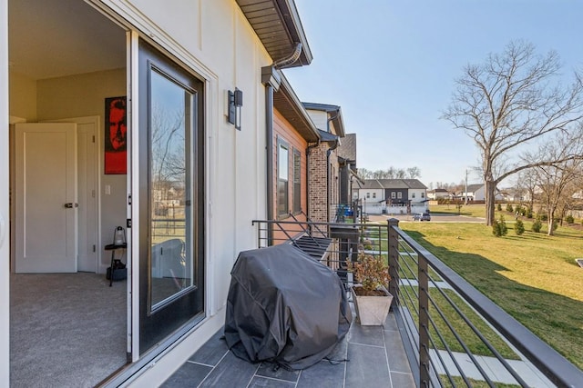 balcony featuring a residential view and a grill