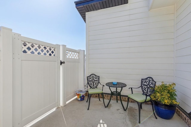 view of patio / terrace with fence and a gate