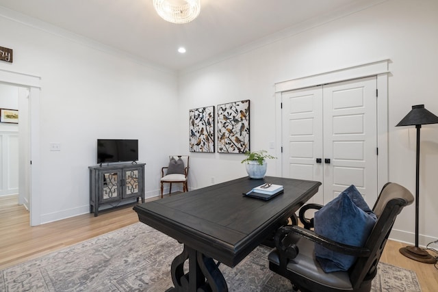 office space featuring crown molding, recessed lighting, baseboards, and light wood finished floors