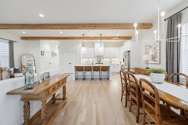 dining area with recessed lighting, beam ceiling, and light wood-style floors