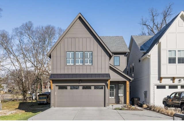 view of front of property with an attached garage, board and batten siding, driveway, and roof with shingles