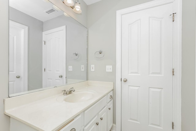 bathroom with visible vents and vanity