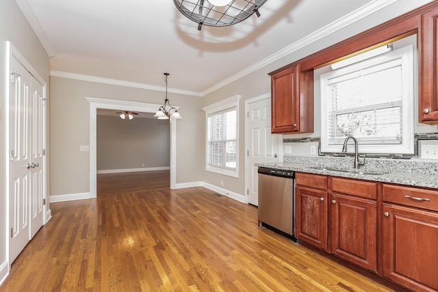 kitchen with a sink, stainless steel dishwasher, light wood-style floors, crown molding, and light stone countertops