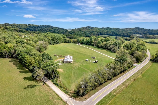 bird's eye view with a rural view and a wooded view