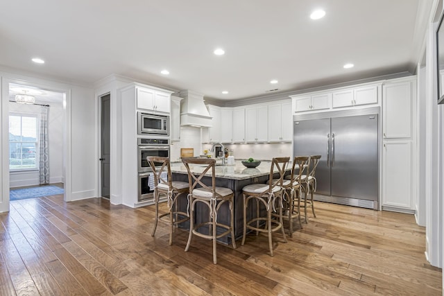 dining space with recessed lighting and light wood-style floors