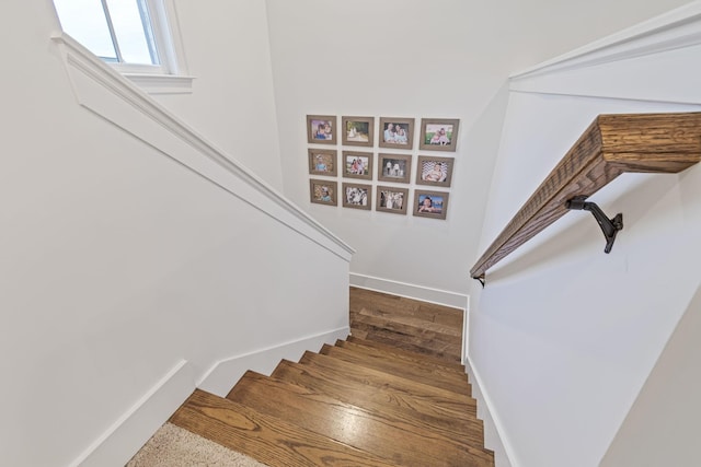 staircase featuring baseboards