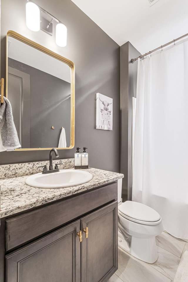 full bathroom with vanity, toilet, and shower / bath combo with shower curtain