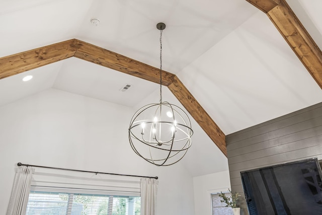 details with an inviting chandelier, beam ceiling, and visible vents