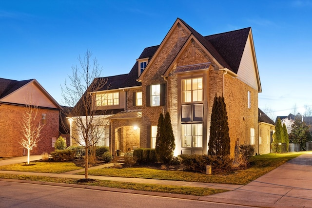 view of front of home with brick siding