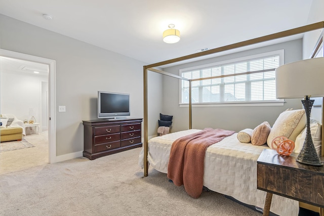 bedroom with a closet, baseboards, visible vents, and carpet floors