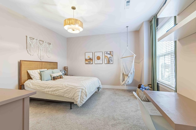 carpeted bedroom featuring visible vents and baseboards