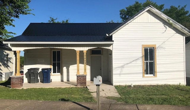 view of front of property with metal roof and covered porch