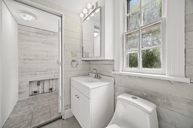 bathroom featuring toilet and vanity