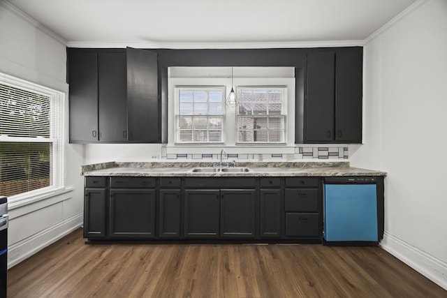 kitchen with dishwasher, ornamental molding, a sink, dark wood-type flooring, and a wealth of natural light