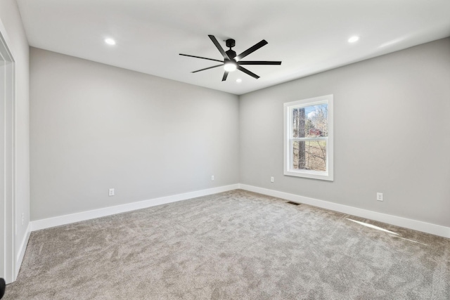 carpeted spare room with a ceiling fan, recessed lighting, visible vents, and baseboards